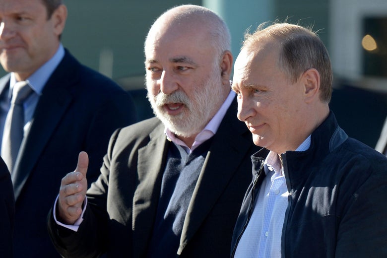 Russian President Vladimir Putin speaks with Viktor Vekselberg in 2014.
